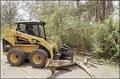 images1 the bobcat out clearing brush