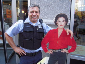 V I with Officer Mota in front of Toni's Patisserie V I with Officer Mota in front of Toni's Patisserie