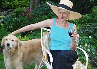 Sara spends her 60th birthday in the garden with her dog and a glass of wine—courtesy of English publishers Hodder & Stoughton. 
